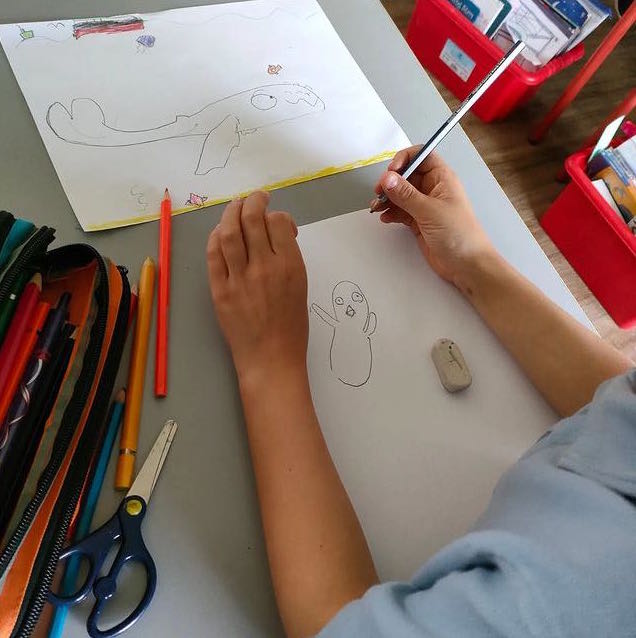 A child drawing Finn and Puffling